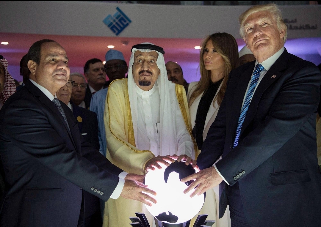 Trump touching glowing orb